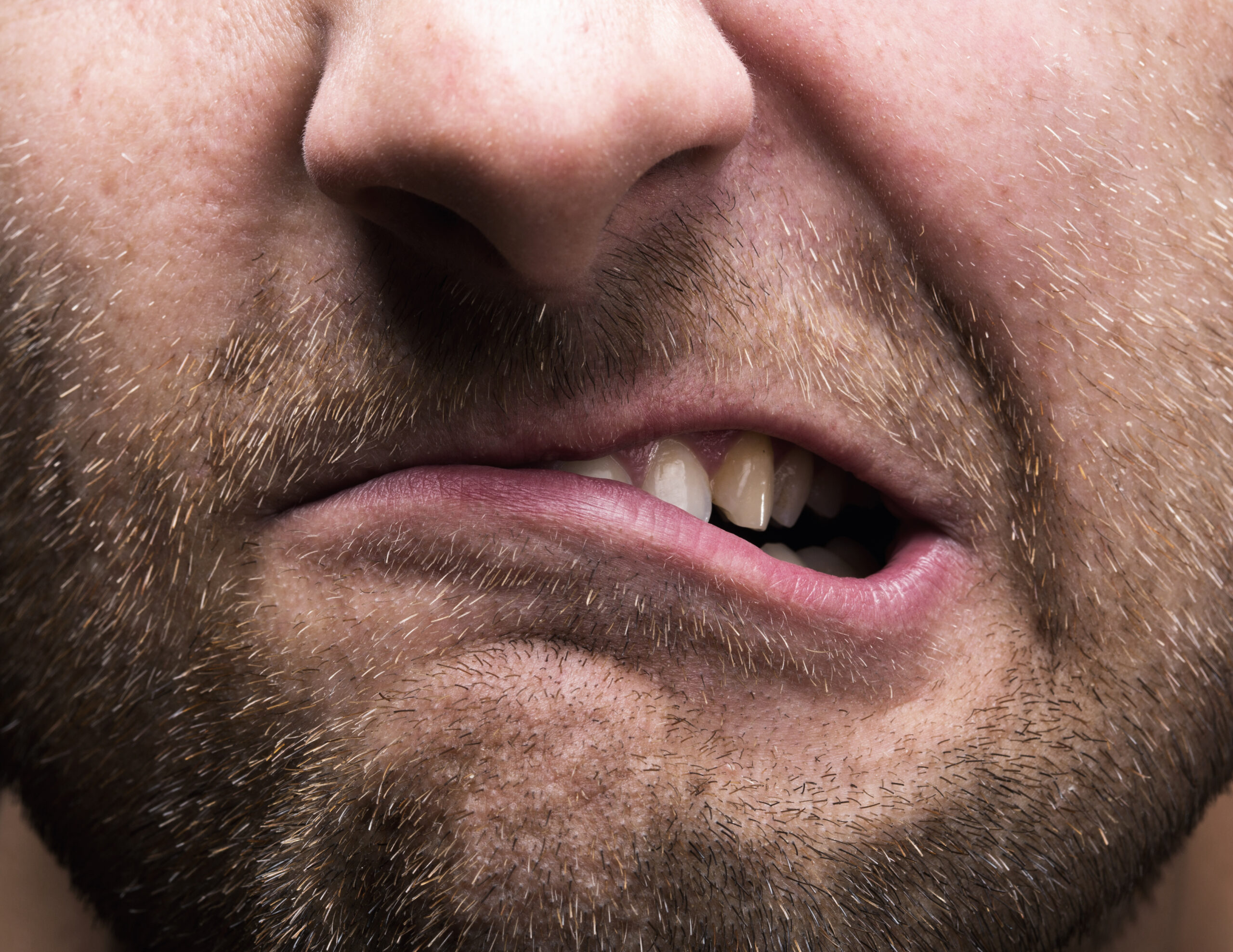 Closeup of mouth of very stressed man